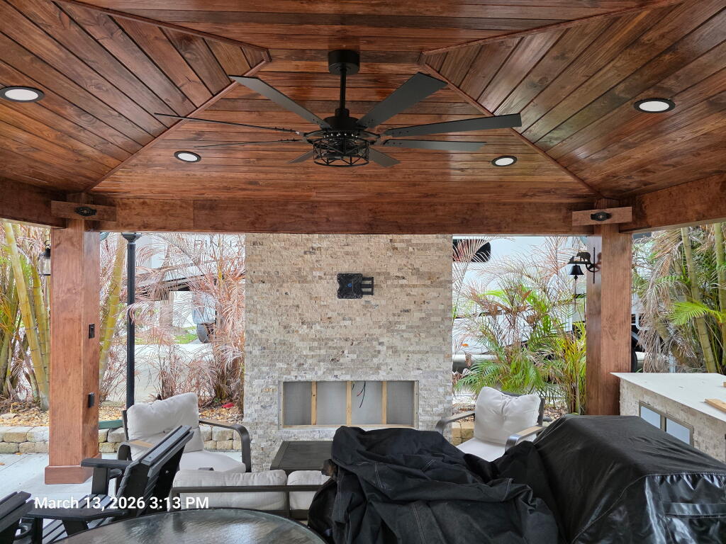 Outdoor living, cozy fireplace to gather family and friends by RSM Builders